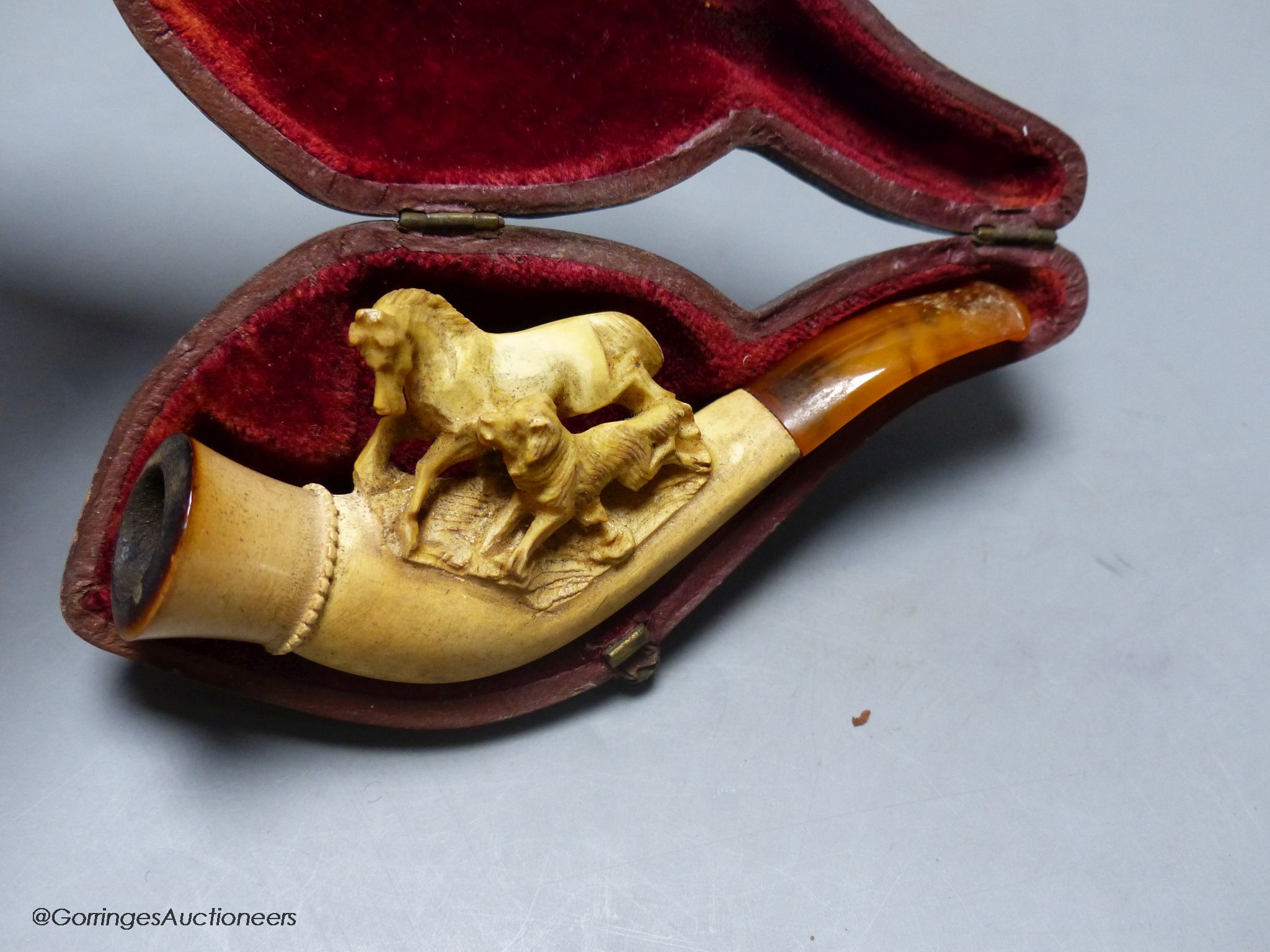 A cased meerschaum pipe